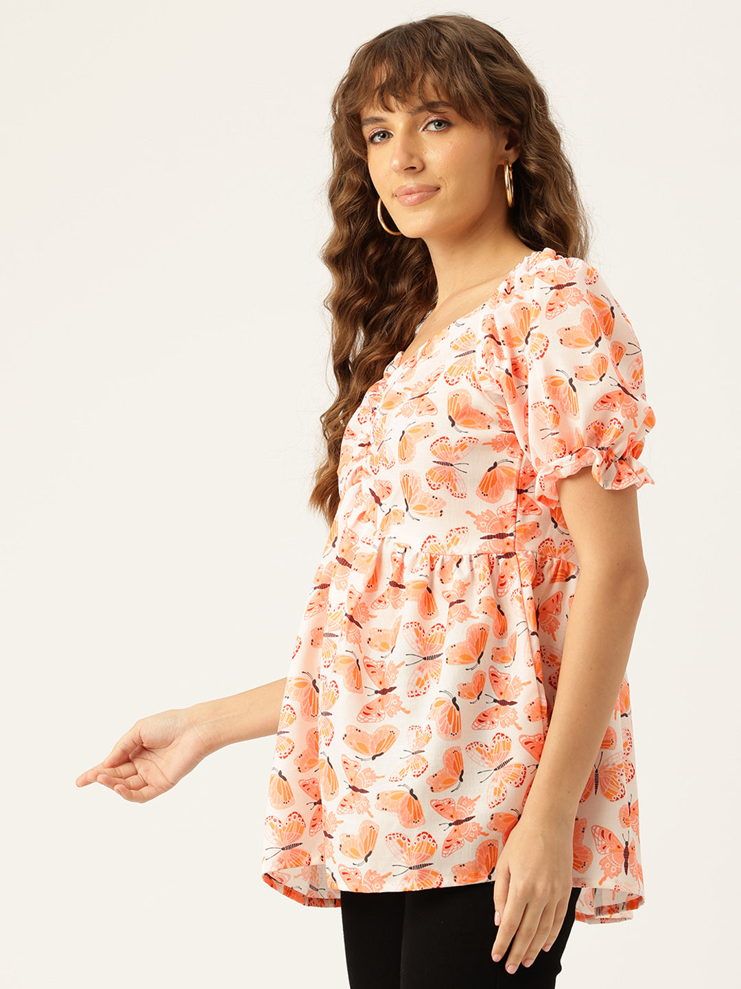 Cropped v-neck peplum puff sleeved top with digital print on linen fabric.