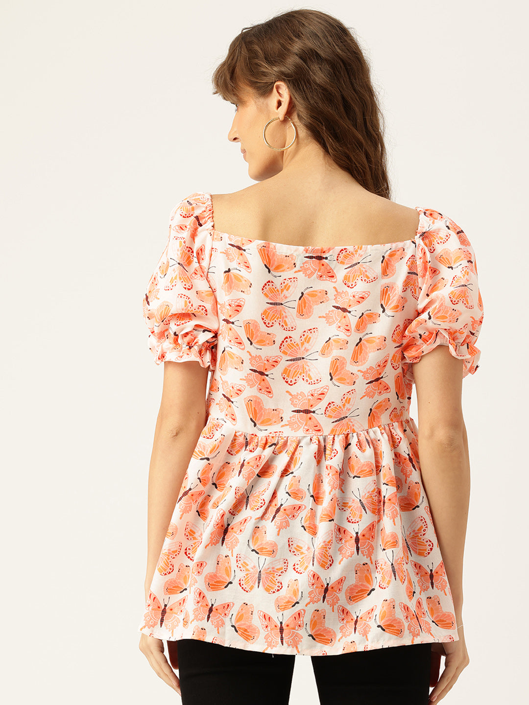 Cropped v-neck peplum puff sleeved top with digital print on linen fabric.
