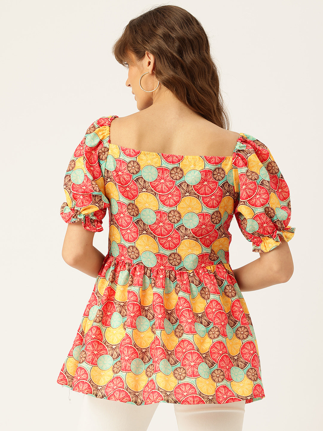 Cropped v-neck peplum puff sleeved top with digital print on linen fabric.