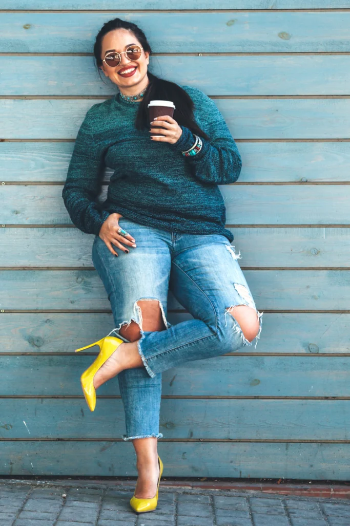 “Curvy woman in American Eagle Curvy Mom jeans with relaxed vintage look”