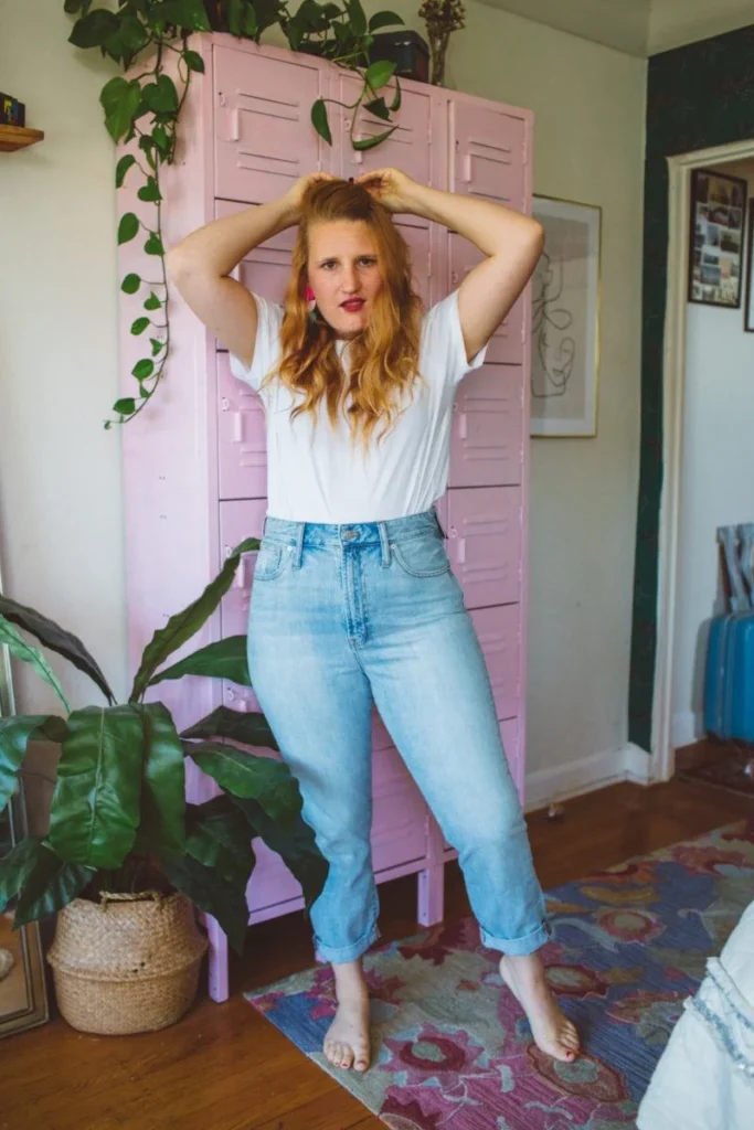 “Curvy woman in Madewell vintage jeans styled with a white tee and sneakers”
