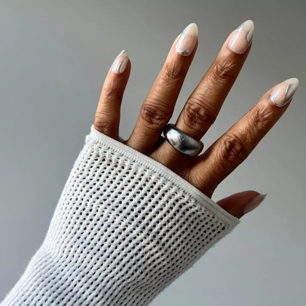 “Minimalist nail art on short nails with nude base and simple geometric lines.”