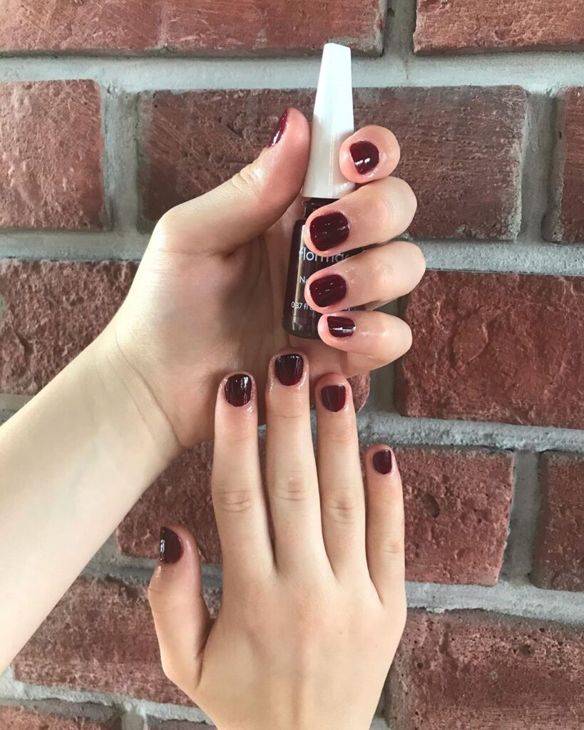 “Example of short nails with common manicure mistakes like thick polish and overcrowded designs.”