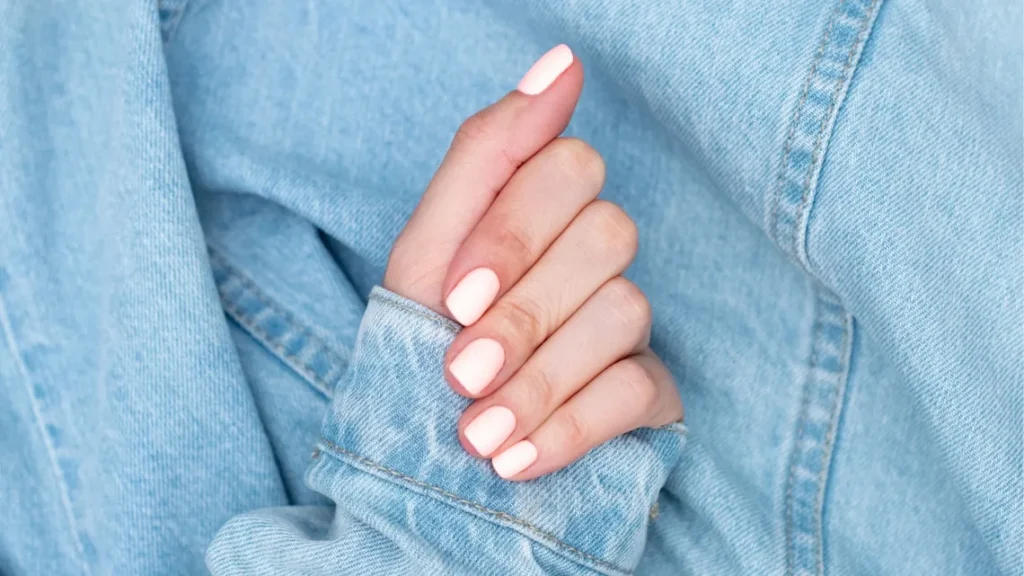 “Short natural nails with modern nail art showing clean and simple manicure styles.”